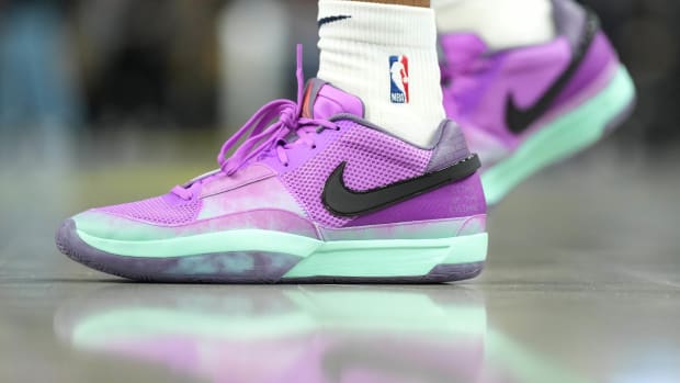 View of Ja Morant's purple and black Nike shoes.